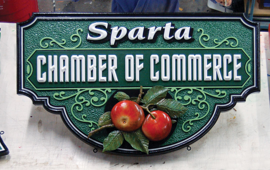 “This is high density urethane board over an Extira exterior panel,” says Sandy, “which gives us something solid to attach hardware to. The HDU graphics fit into routed indents for easier painting and clean edges when assembled. We also fabricated a custom welded bracket this sign hangs on.”