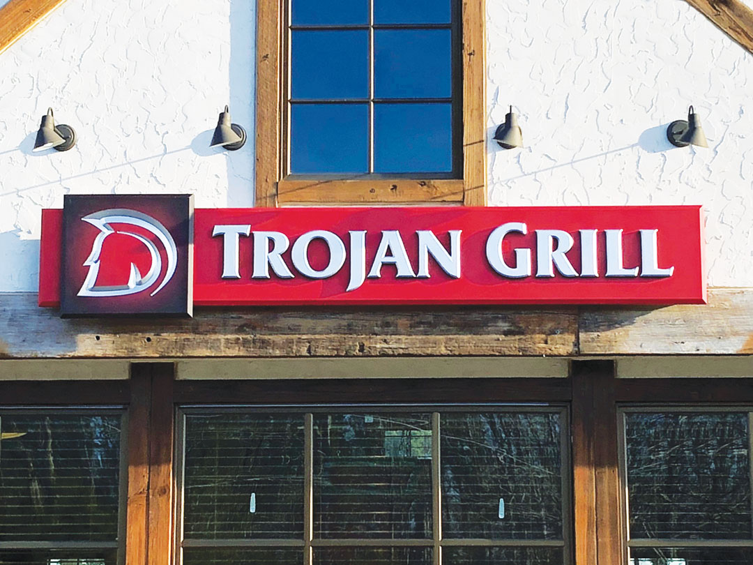 CNC-carved HDU prismatic letters on a 2-by-12-ft. HDU panel backed with overlaid plywood. Graphic panel is HDU. Letters and graphic are finished with 1 Shot Metallic Silver enamel. Michael Keene, Woodcraft Sign Shoppe, Richmond, Virginia