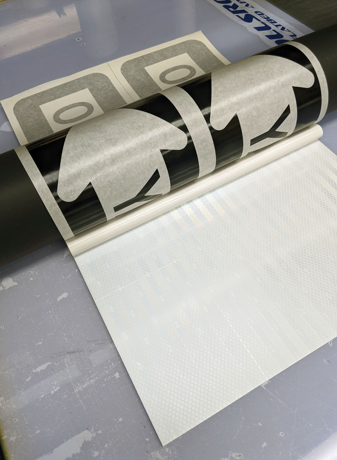 Using the applicator table once more, I applied the graphics to the reflective film that I had applied to the aluminum.