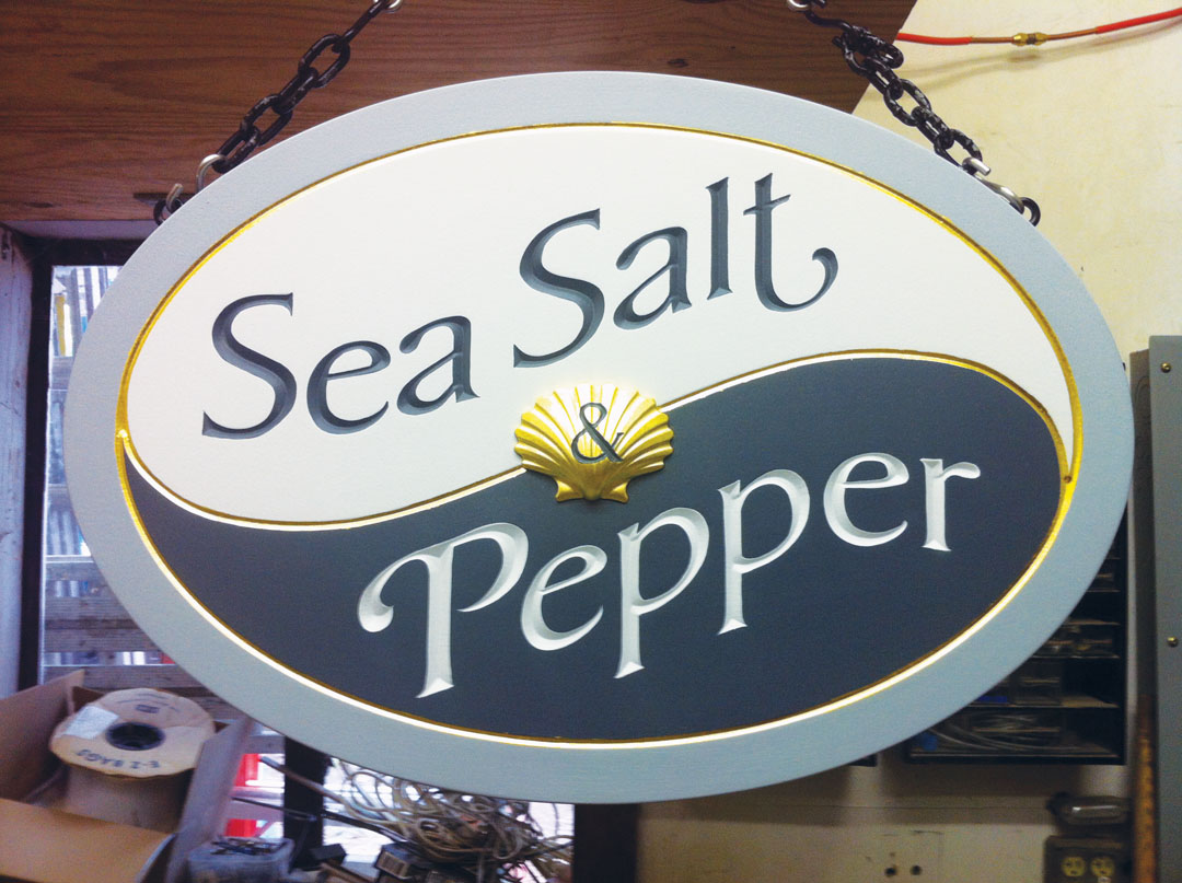 Double-faced sign made of two layers of <a href="/recommends/signfoam" target="_blank" rel="noopener noreferrer">1½-in. 18-lb. SignFoam HDU board</a> with ¾-in. overlaid plywood laminated between, with mahogany blocks to receive the screw eyes. David Hassan, Hassan Sign Co., Cohasset, Massachusetts